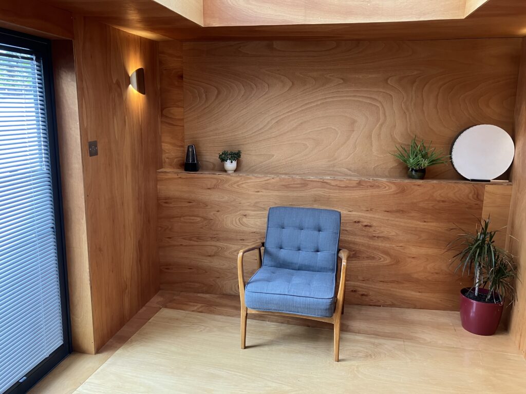 A comfortable chair in a psychotherapy consultation room in Canterbury, providing a private space for therapy with a male therapist, focused on men’s mental health.